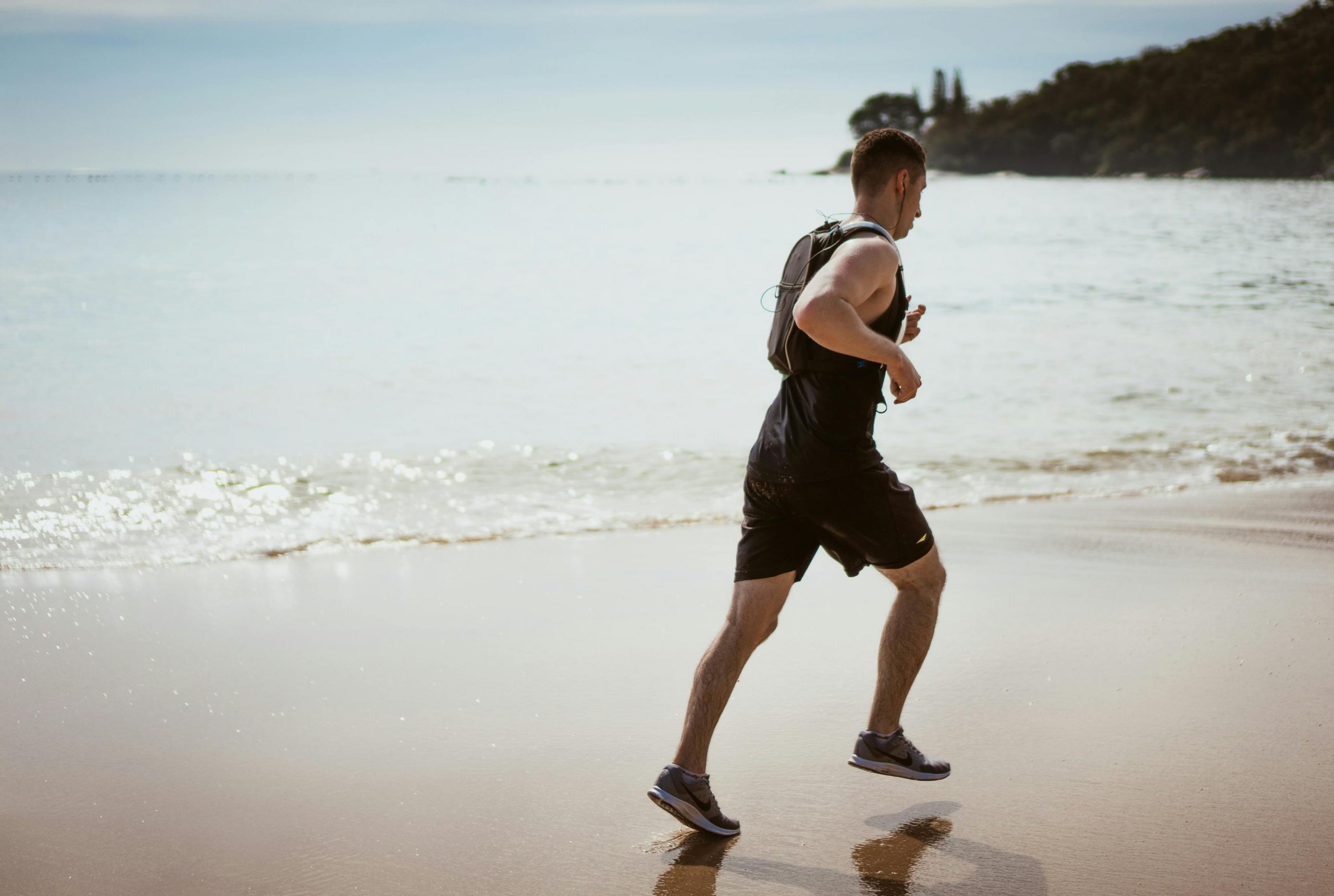 Mann Strand Joggen